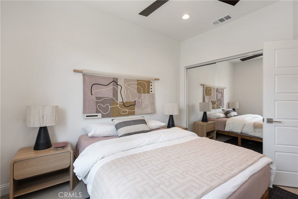 161 Steely Irvine, CA 92614 - Photo 26 of 35 a bedroom with a bed and wooden floor