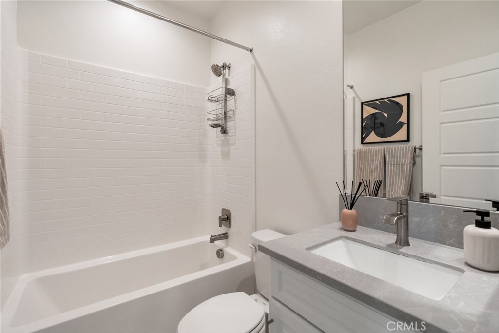161 Steely Irvine, CA 92614 - Photo 27 of 35 a bathroom with a granite countertop sink mirror toilet and bathtub