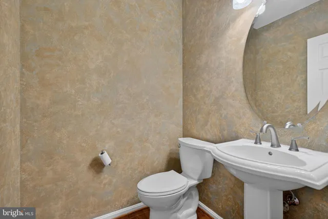 a living room with furniture or wooden floor and a large window