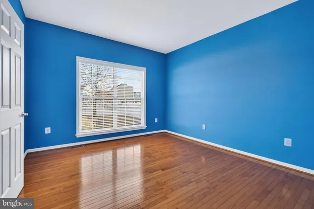a kitchen with granite countertop a refrigerator stove top oven and sink