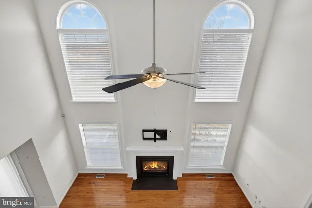 a small walk in closet room with a window