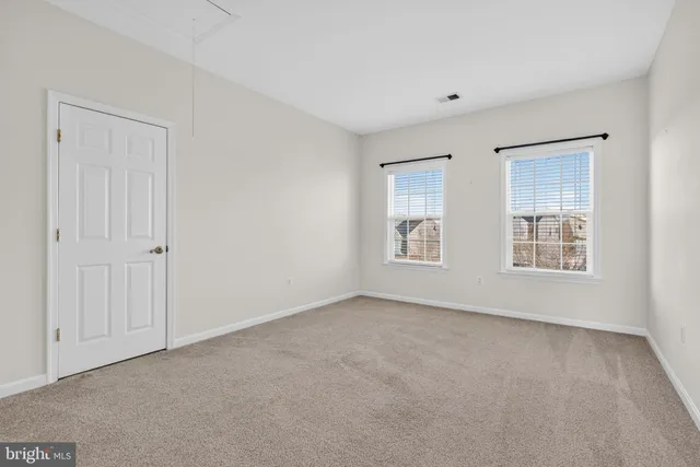 a view of a room with wooden walls