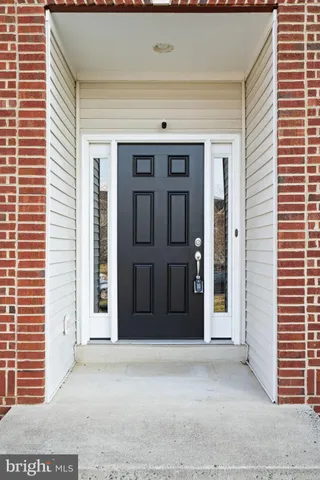 a room with a wooden floor and a window