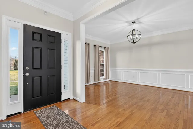 a bedroom with bed and a table