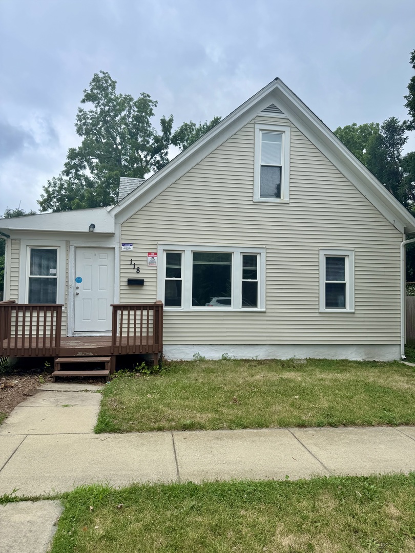 118 Wilcox Avenue Elgin, IL 60123 - Photo 1 of 29 a front view of a house with a yard