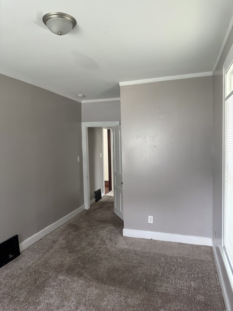 118 Wilcox Avenue Elgin, IL 60123 - Photo 14 of 29 an empty room with window