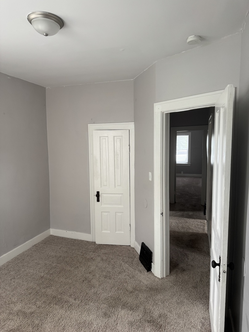 118 Wilcox Avenue Elgin, IL 60123 - Photo 16 of 29 an empty room with closet area
