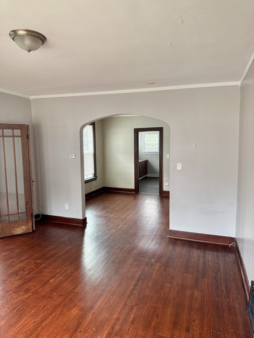 118 Wilcox Avenue Elgin, IL 60123 - Photo 6 of 29 an empty room with wooden floor and closet
