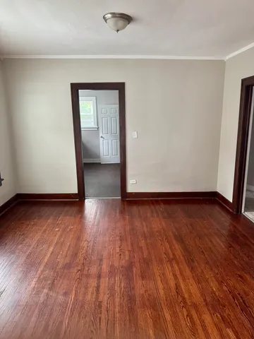 a kitchen with a refrigerator and a stove top oven