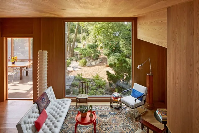 a kitchen with granite countertop a sink a stove and cabinets