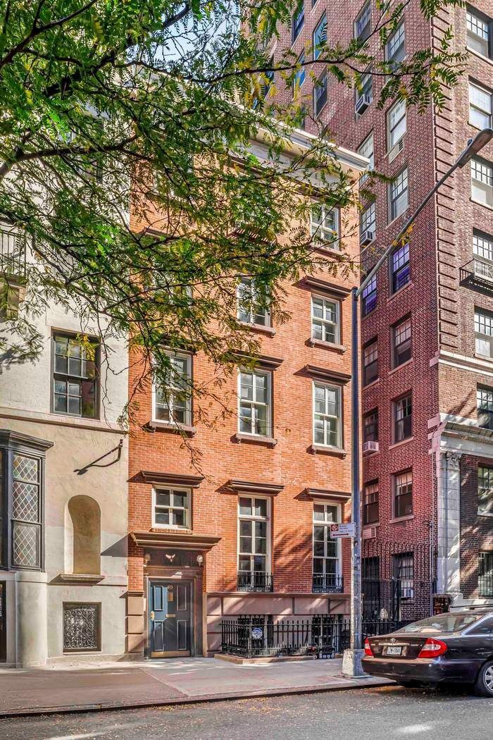 a city street lined with buildings and cars