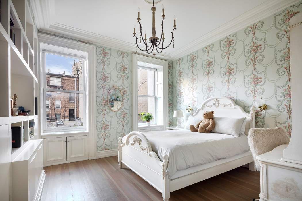 69 Washington Place, Unit 3/4/5 Manhattan, NY 10011 - Photo 12 of 26 a bedroom with a large bed and a chandelier