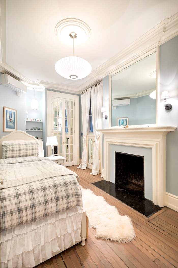 69 Washington Place, Unit 3/4/5 Manhattan, NY 10011 - Photo 14 of 26 a bedroom with a bed and a fireplace