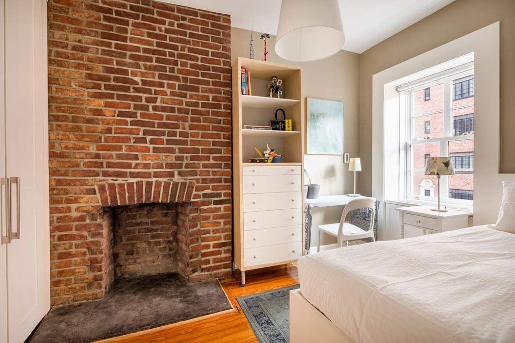 69 Washington Place, Unit 3/4/5 Manhattan, NY 10011 - Photo 16 of 26 a bedroom with a bed and a chair in it