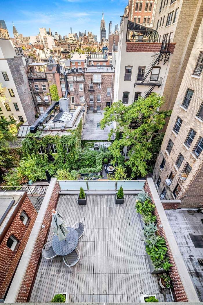 69 Washington Place, Unit 3/4/5 Manhattan, NY 10011 - Photo 21 of 26 a view of a swimming pool with outdoor seating and plants
