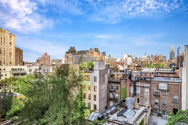 a balcony view with a seating space