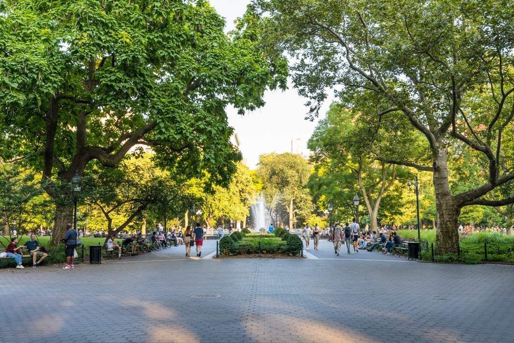 69 Washington Place, Unit 3/4/5 Manhattan, NY 10011 - Photo 24 of 26 a view of a street with trees and houses in the background