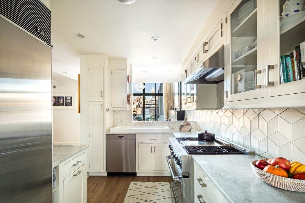 69 Washington Place, Unit 3/4/5 Manhattan, NY 10011 - Photo 6 of 26 a kitchen with a sink stove and refrigerator