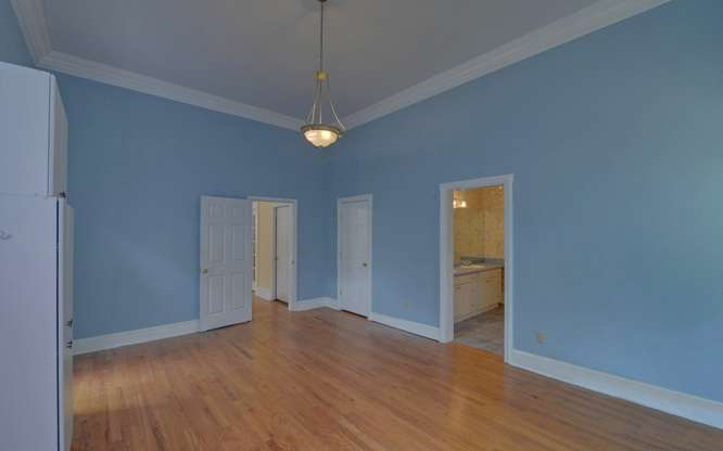 330 River Road Westminster, SC 29693 - Photo 17 of 45 Hardwood flooring and crisp crown molding frame this versatile, naturally illuminated room, offering seamless flow to adjacent spaces.