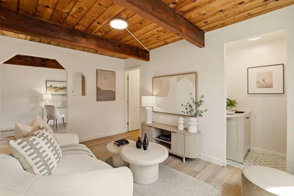 a living room with furniture and a table