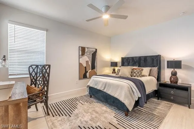 a balcony with furniture and a potted plant