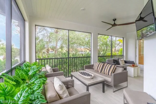 a living room with furniture and windows