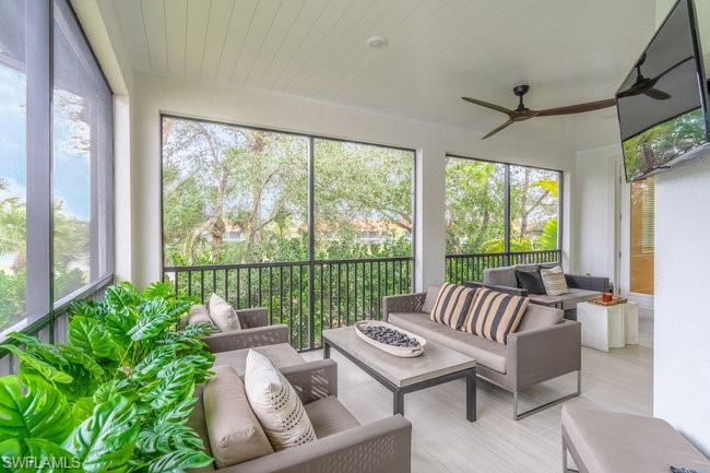 16907 Fairgrove Way, Unit 201 Naples, FL 34110 - Photo 17 of 28 a balcony with furniture and a potted plant