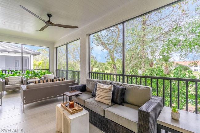 16907 Fairgrove Way, Unit 201 Naples, FL 34110 - Photo 18 of 28 a living room with furniture and windows