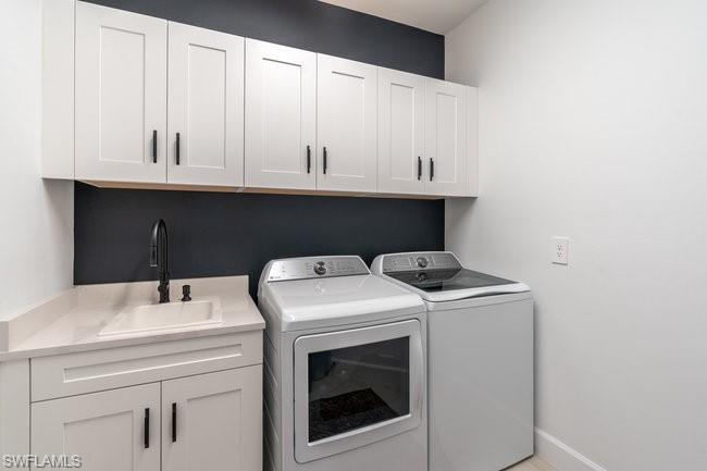 16907 Fairgrove Way, Unit 201 Naples, FL 34110 - Photo 19 of 28 a utility room with dryer and washer