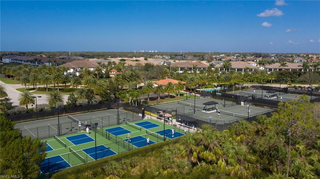16907 Fairgrove Way, Unit 201 Naples, FL 34110 - Photo 22 of 28 an aerial view of multiple house