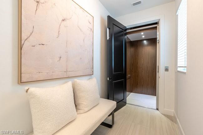 16907 Fairgrove Way, Unit 201 Naples, FL 34110 - Photo 4 of 28 a bedroom with a bed and a shower