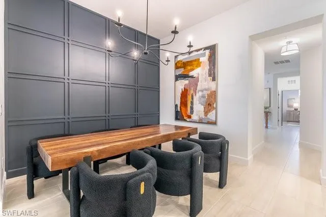 a living room with furniture ceiling fan and a fireplace