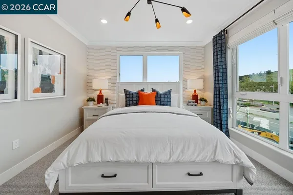 a bedroom with a bed and window