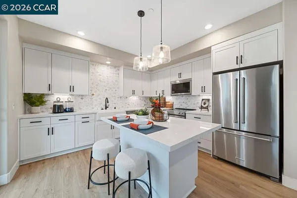 a kitchen with a refrigerator a stove a sink and a refrigerator