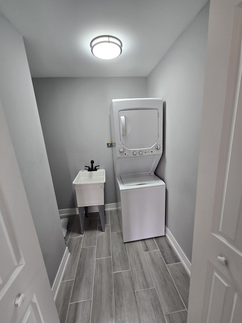 6024 Birmingham Street Chicago Ridge, IL 60415 - Photo 20 of 21 a room with a sink mirror and toilet