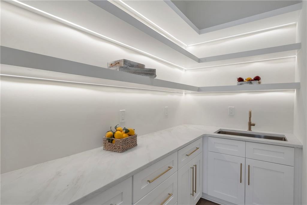3610 Fleming Drive Cumming, GA 30041 - Photo 14 of 51 a kitchen with a sink and cabinets