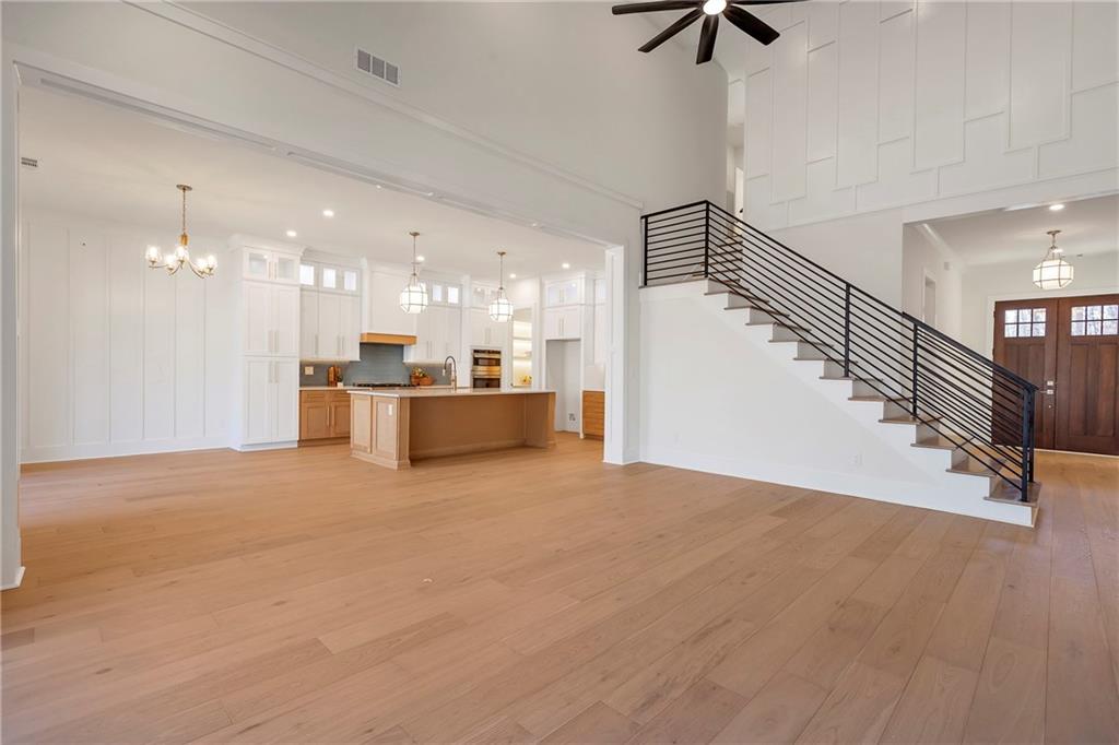 3610 Fleming Drive Cumming, GA 30041 - Photo 17 of 51 a view of a livingroom with a ceiling fan and kitchen view