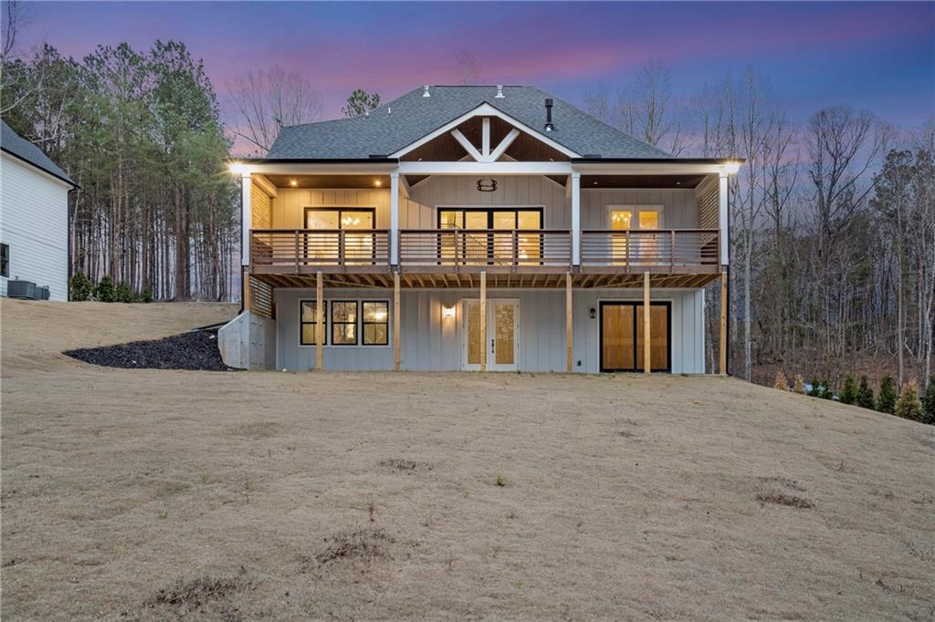 3610 Fleming Drive Cumming, GA 30041 - Photo 2 of 51 a front view of a house with a yard and garage