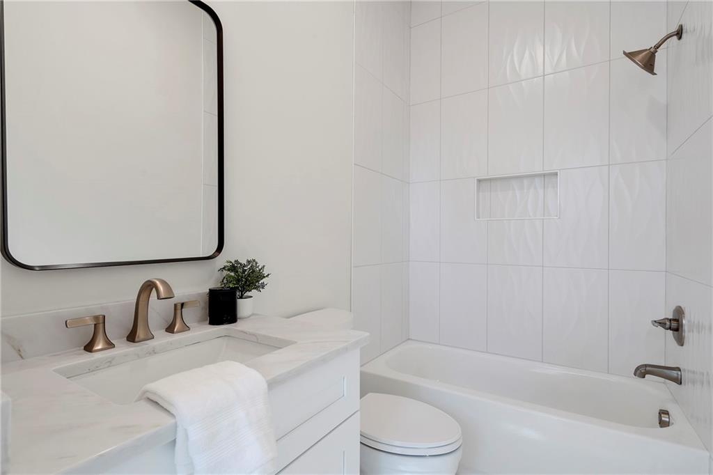 3610 Fleming Drive Cumming, GA 30041 - Photo 24 of 51 a bathroom with a granite countertop sink and a bathtub