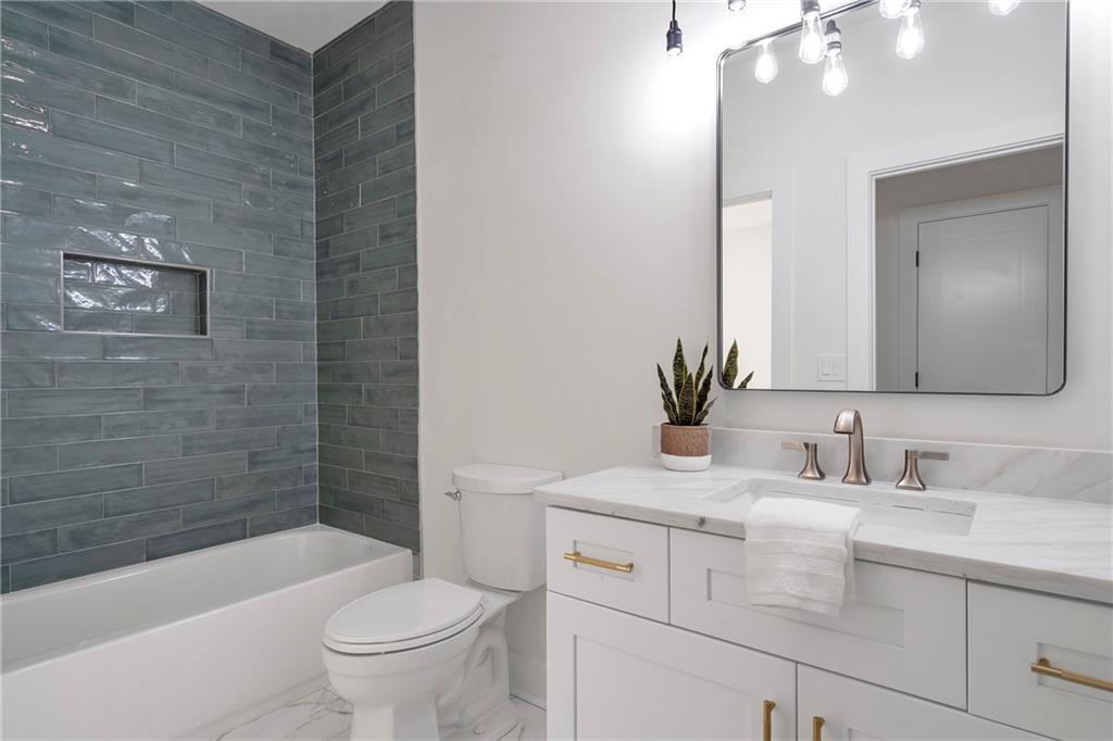 3610 Fleming Drive Cumming, GA 30041 - Photo 34 of 51 a bathroom with a sink a toilet and bathtub