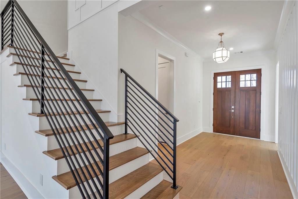 3610 Fleming Drive Cumming, GA 30041 - Photo 6 of 51 a view of a hallway with wooden floor and staircase