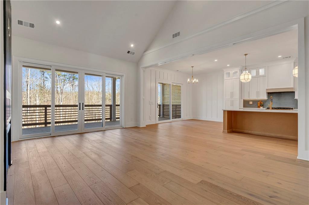 3610 Fleming Drive Cumming, GA 30041 - Photo 7 of 51 a view of an empty room with a kitchen and a window