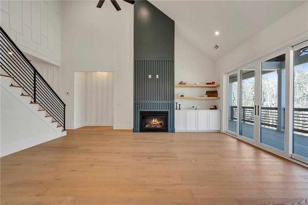 3610 Fleming Drive Cumming, GA 30041 - Photo 8 of 51 a view of empty room with wooden floor and fireplace