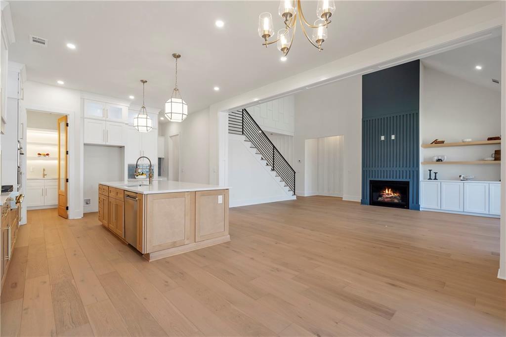 3610 Fleming Drive Cumming, GA 30041 - Photo 9 of 51 a view of a kitchen with a sink and a fireplace
