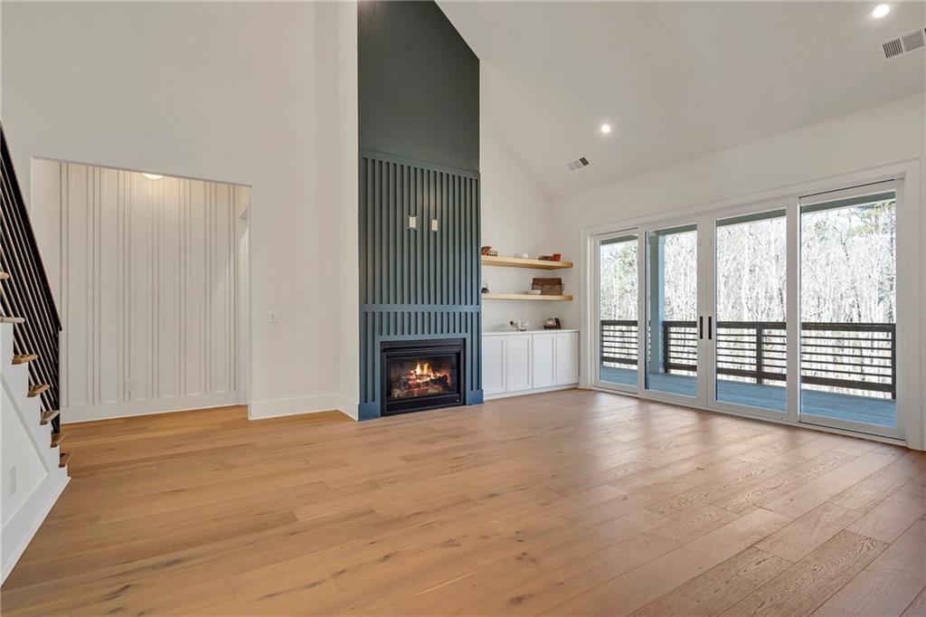 3610 Fleming Drive Cumming, GA 30041 - Photo 10 of 51 a view of an empty room with a fireplace and a window