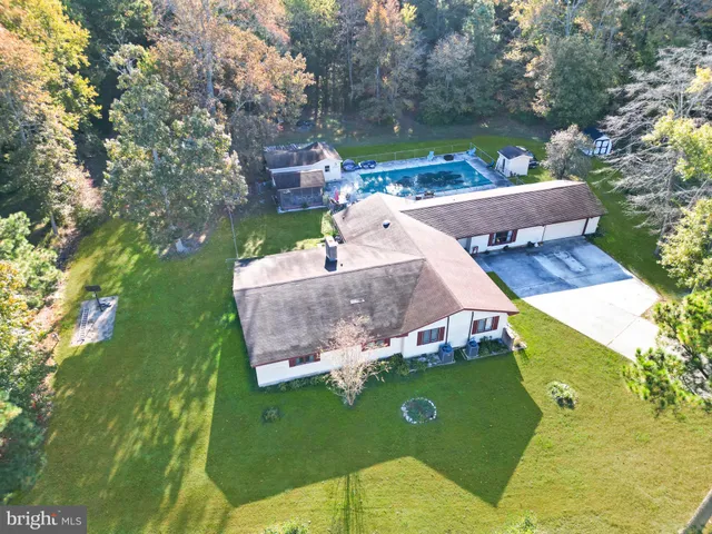 an aerial view of a house with a garden