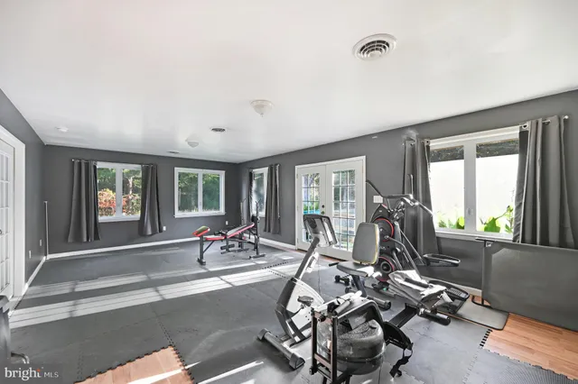 an aerial view of a house with pool yard and outdoor seating