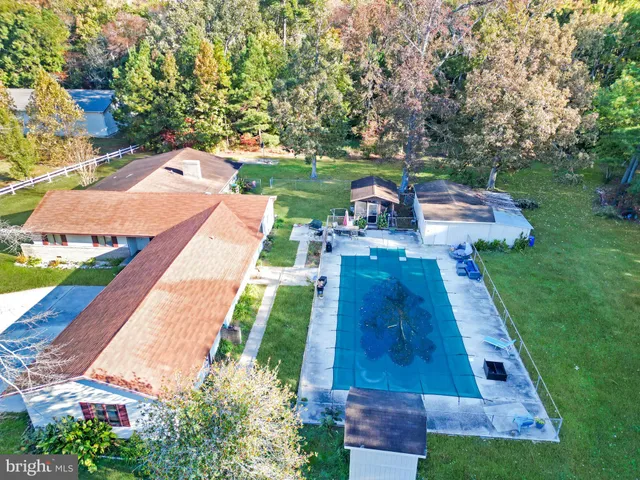 a backyard of a house with plants and a garden
