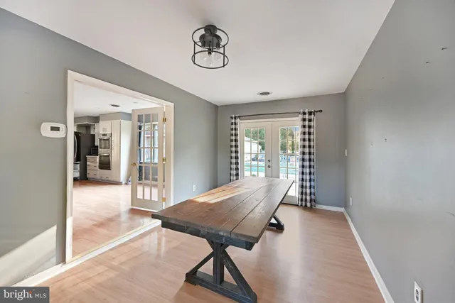 a view of a hallway with furniture and front door