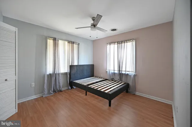 a bedroom with a bed and a piano